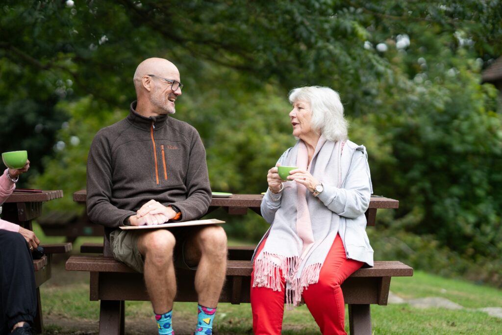 Adult and family member having a supportive conversation at home